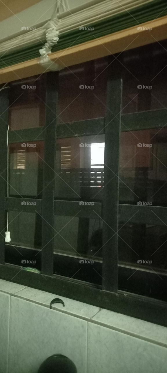 Twinkling windows , the beauty of evening light. Bask in the beauty of evening light with the view of light twinkling from these windows at night