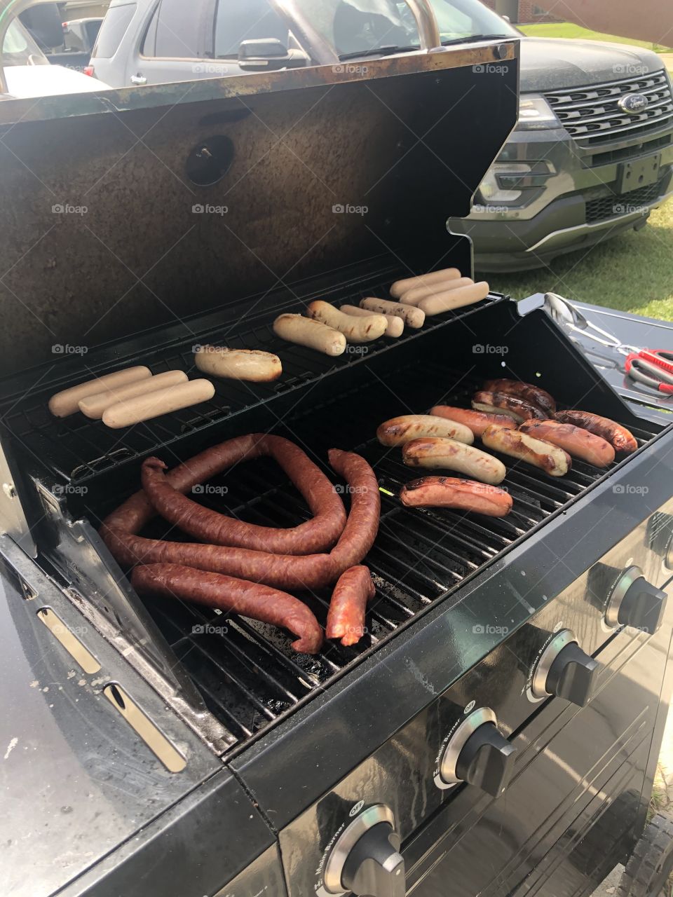 White hots and reshoots with a coiled up sausage on the grill