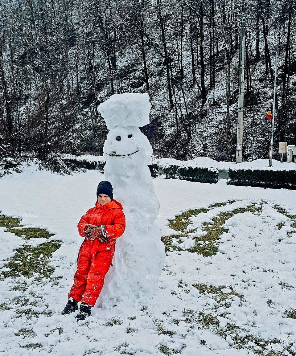 child and his snowman