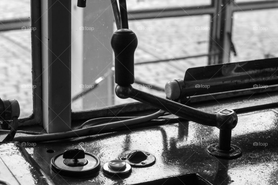 Black-white view of the stering handlebar in retro tram