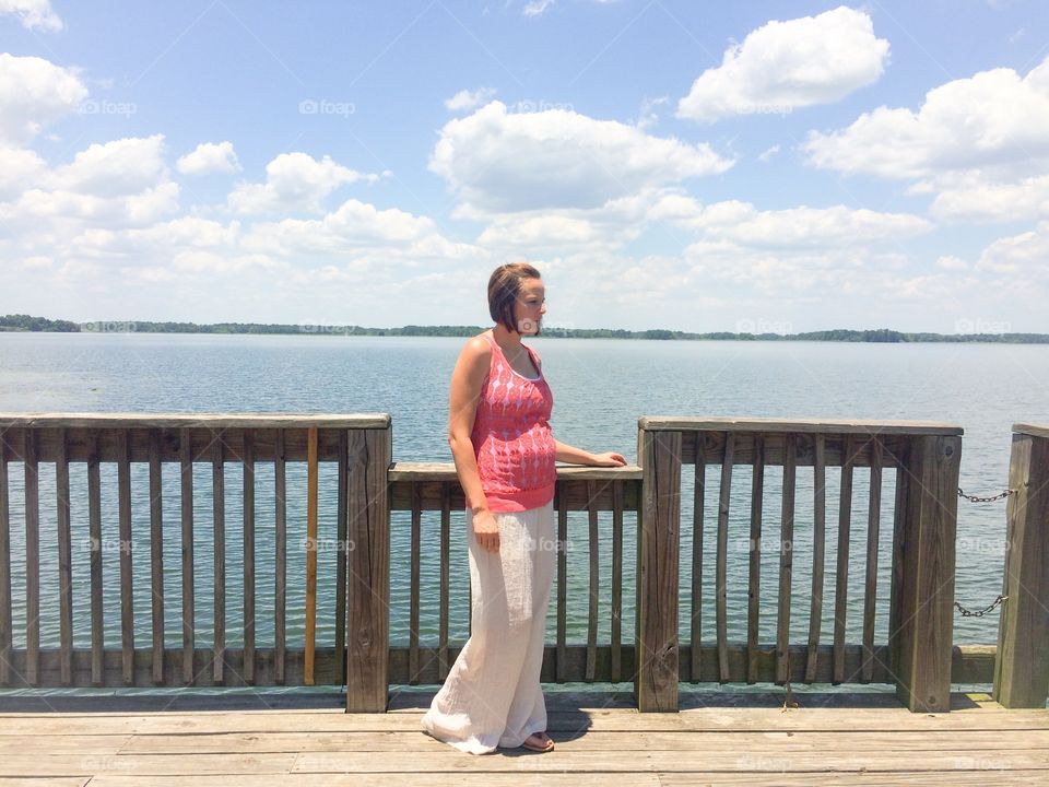 Mature woman standing near railing