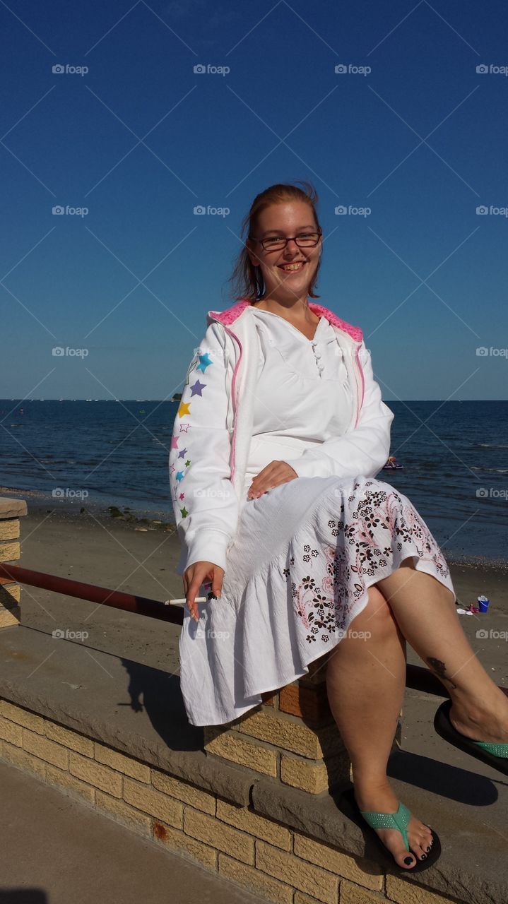 Smiling woman with cigarette