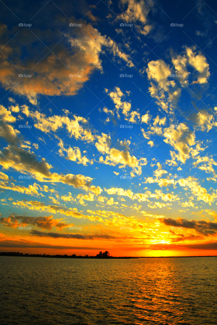 Beautiful sunset in sea with cloud