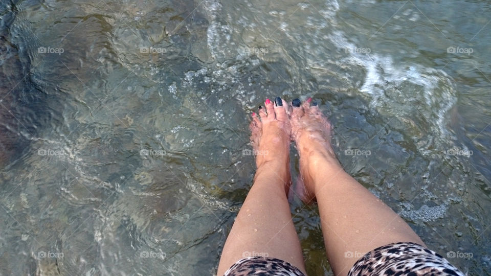 feet in the river