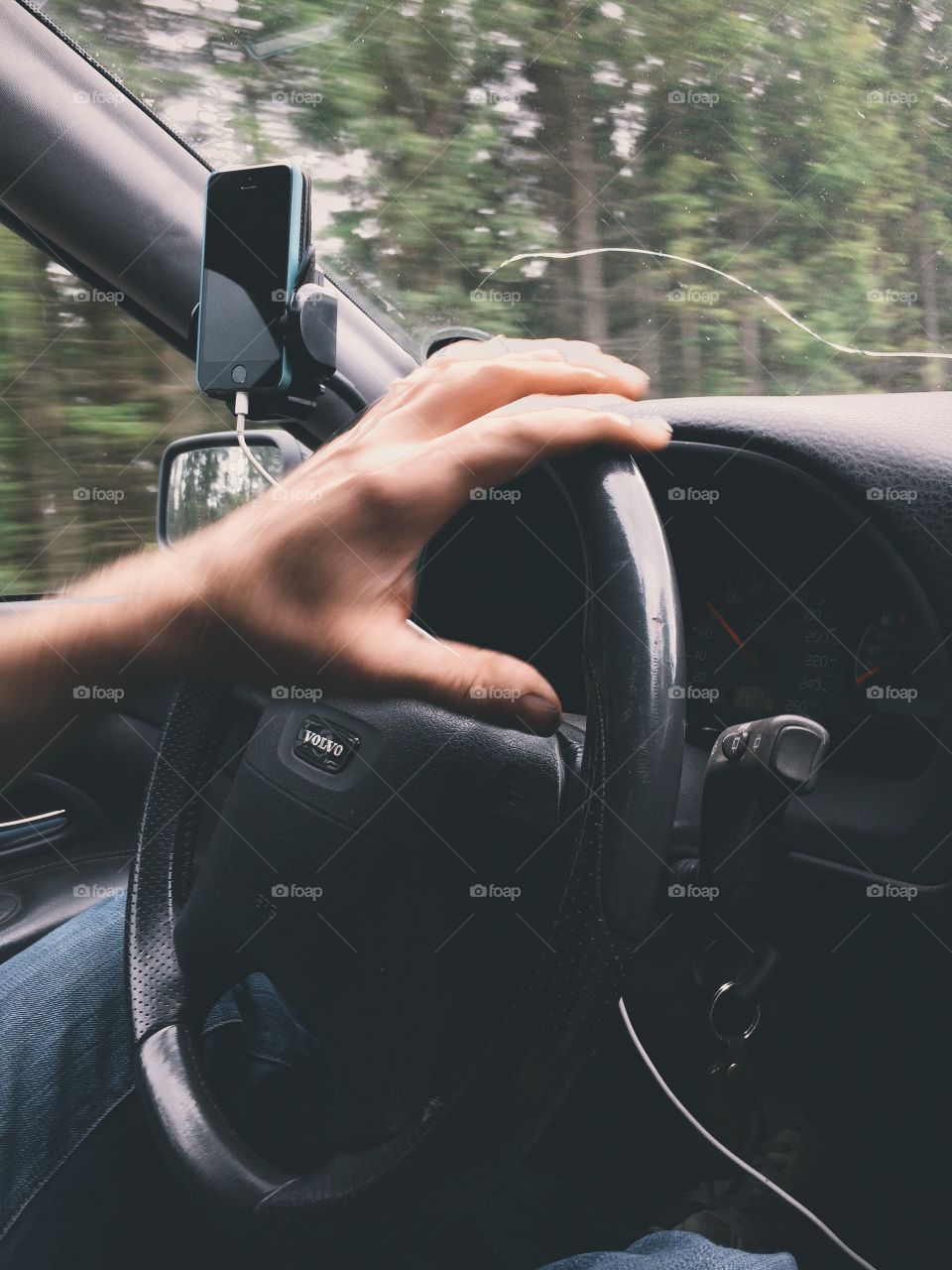 Driving. A man driving the car