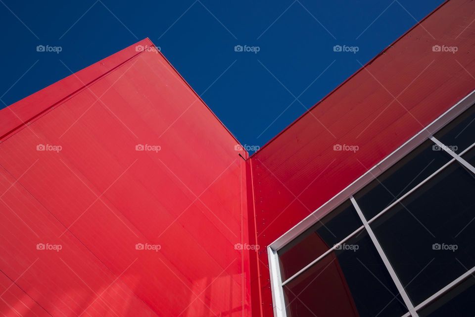Low Angle View Of  Modern Office Building with Red Facade .