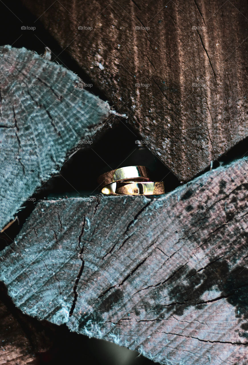 Metal on woods. Gold always stand out regardless of placement and location. It just shines brighter!