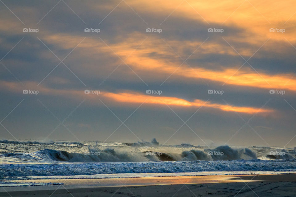 Surf’s Up in the Hamptons.  A New Year’s Day winter sunset on Long Island, New York at the ocean.