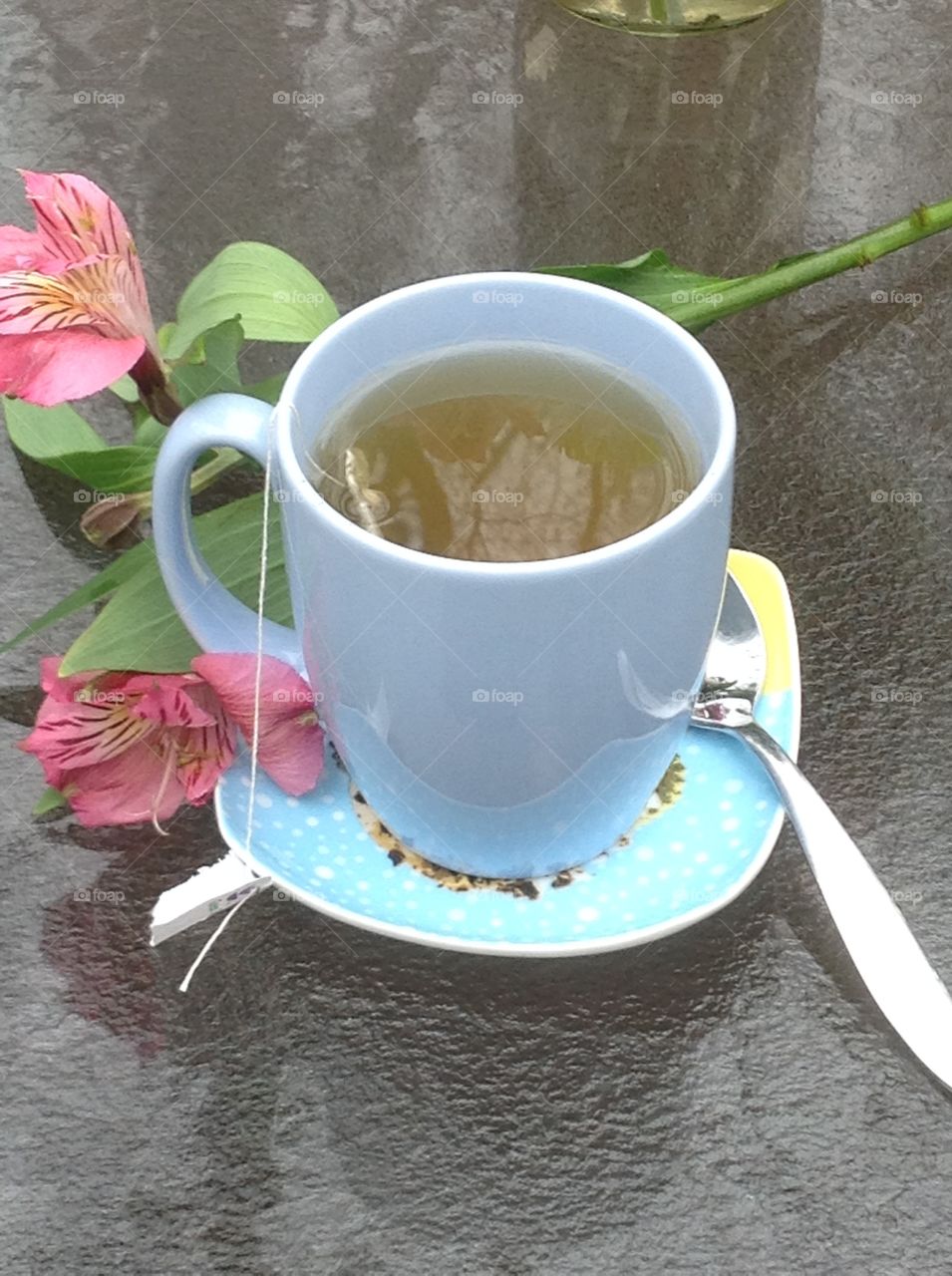 Having a cup of tea outdoors enjoying the beautiful Spring weather.