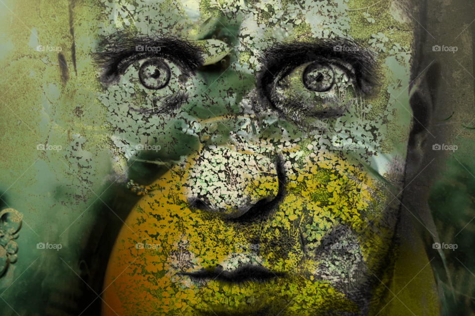 Graphic art with portrait of a man with green and yellow skin covered with texture in the form of moss, lichen and invasive plants, man with deep and hypnotic gaze.