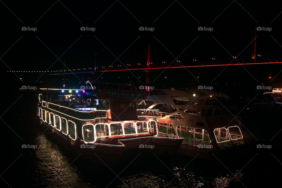 A cruise waiting for passengers at the port. Looks quite fancy and shiny.