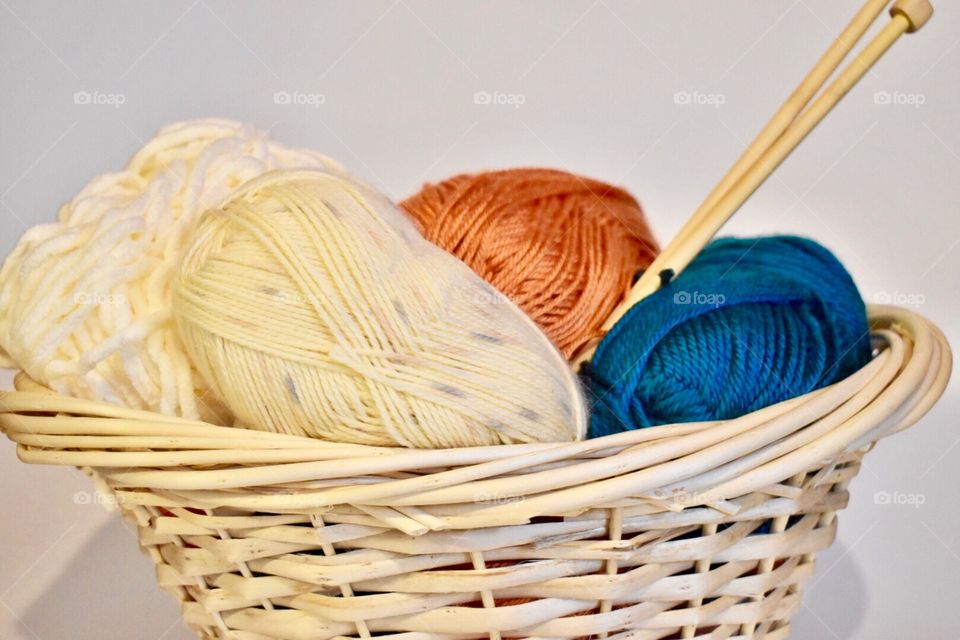 Ball of wool and knitting needle