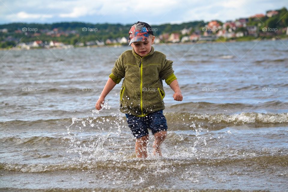 Boy playing in the water