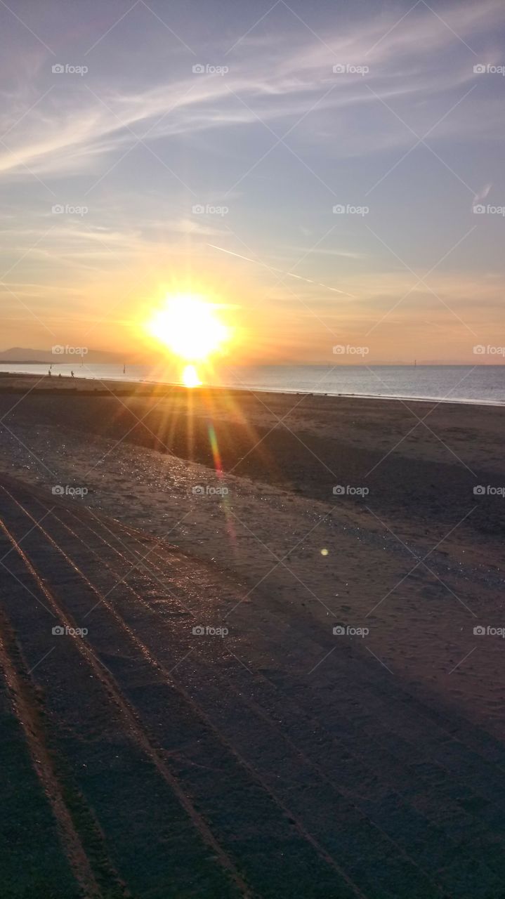 i was in rhyl, wales and it was a day out at the beach the sun started to set and looked beautiful