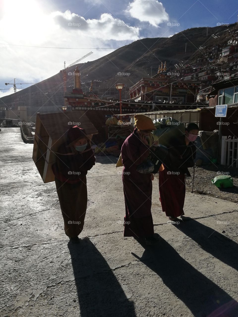 Nun staring into the Valley at Se Da Buddhist Monastery and School in Sichuan Province, China.

Se Da is currently the largest Tibetan Buddhist school in the world and not open to westerners.