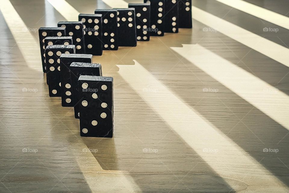 Domino Pieces on a background of shadows