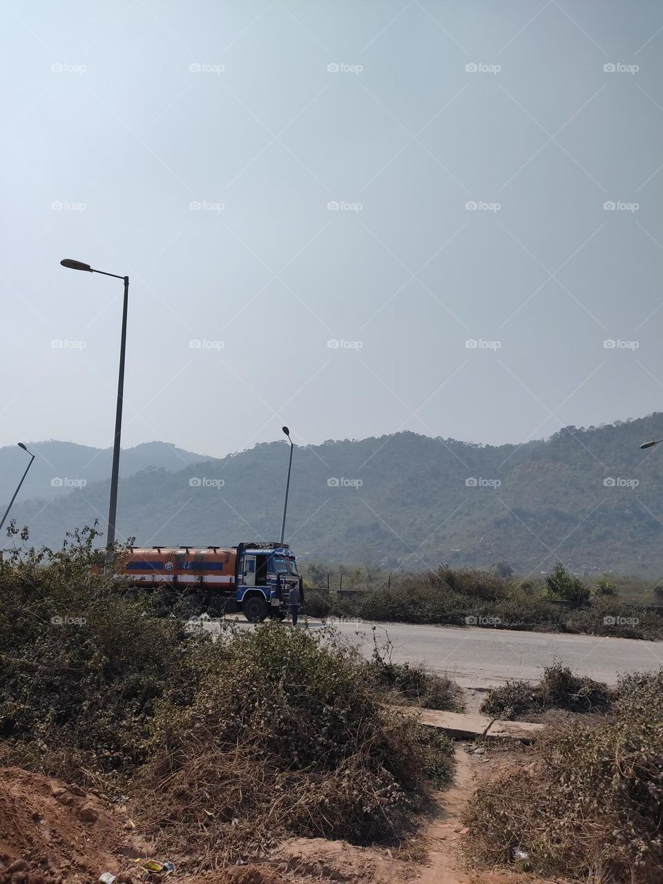 A truck is parked on the side of the road.