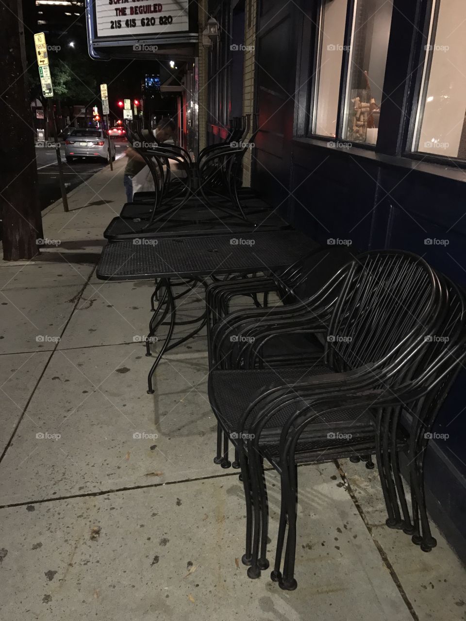 End of night closing of the outside patio at a downtown resturaunt. Stacking chairs is a workout. 