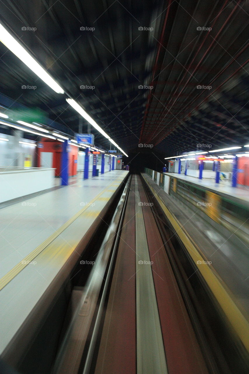 a speeding train passing across the station