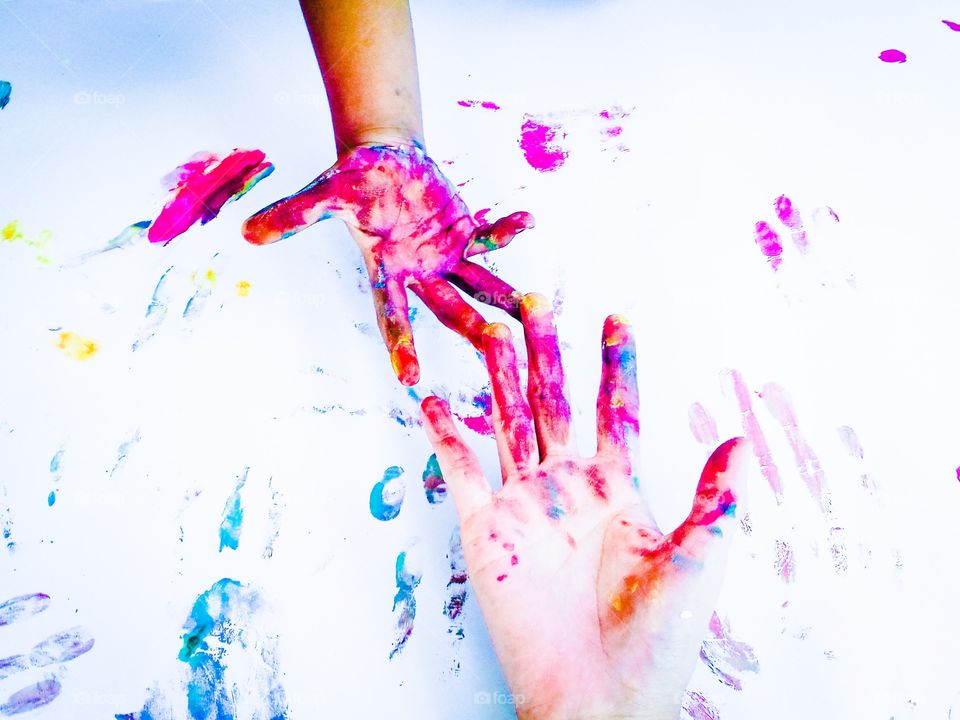 Happy child with paint on the hands