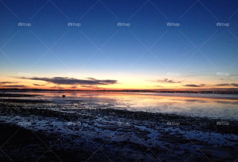 Sky and Ocean together as one. Colour and sunset by the sea 