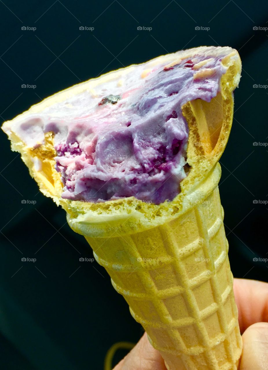 Ice cream cone in front of black background