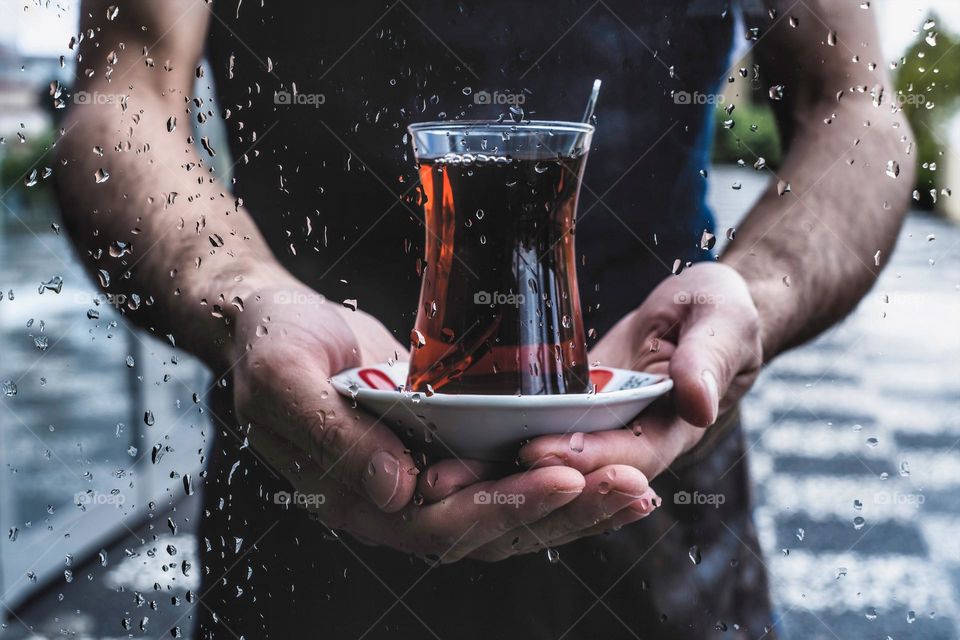 Hands holding tea