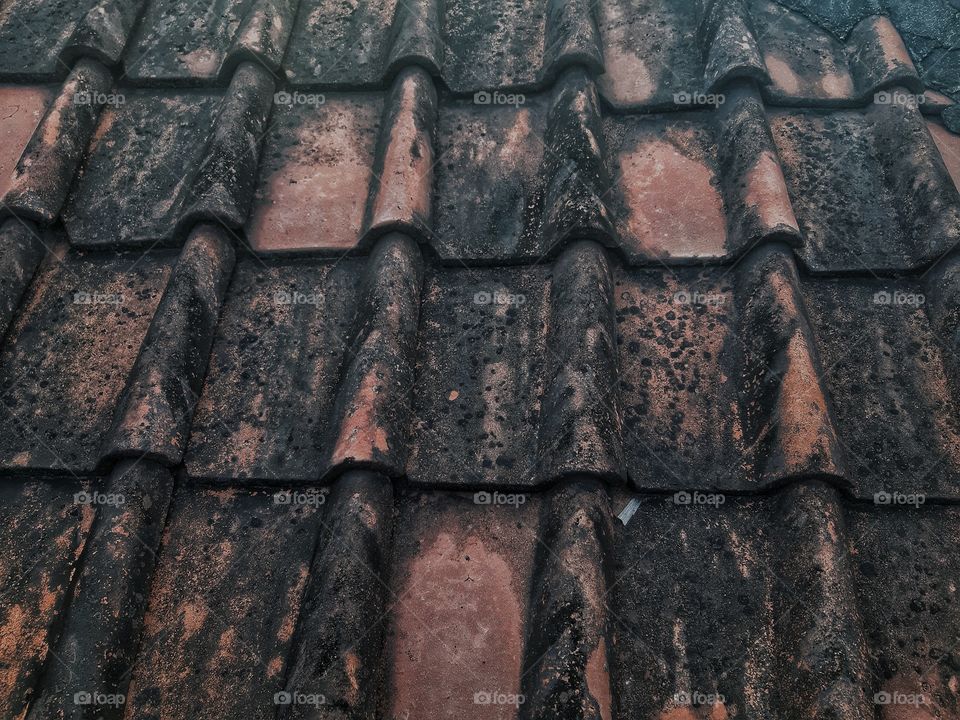 a close up texture of roof tiles made of clay
