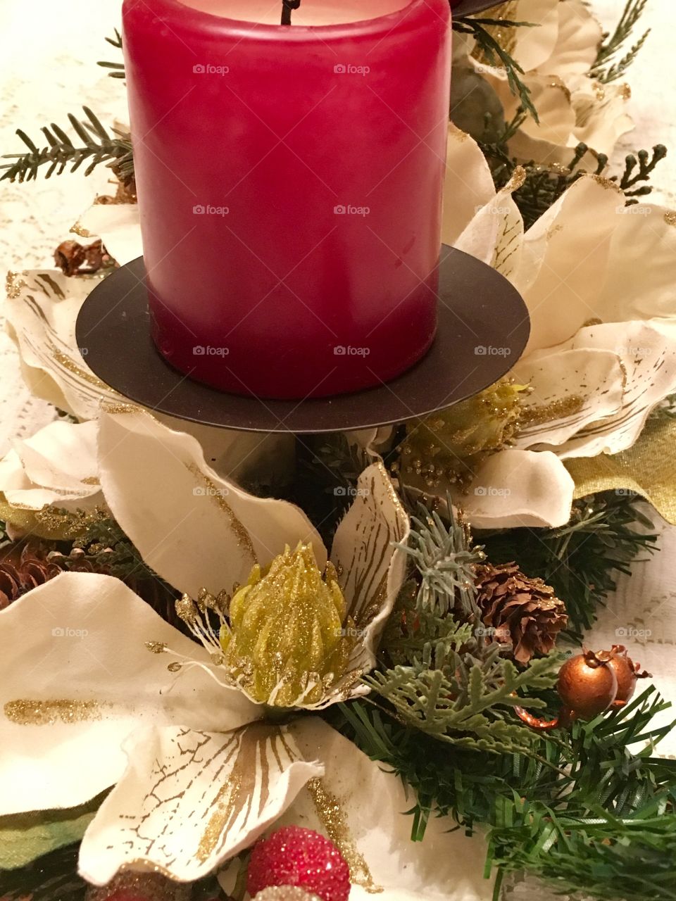 Christmas floral arrangement with candle