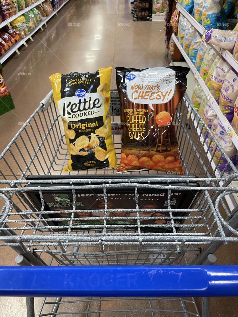 Shopping in the grocery store, deciding on purchases, buying chips in the grocery store, shopping for snacks, first person perspective 