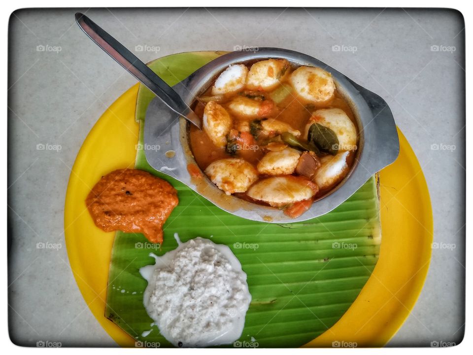 Mini idlis dipped in sambhar, a delicacy in South India