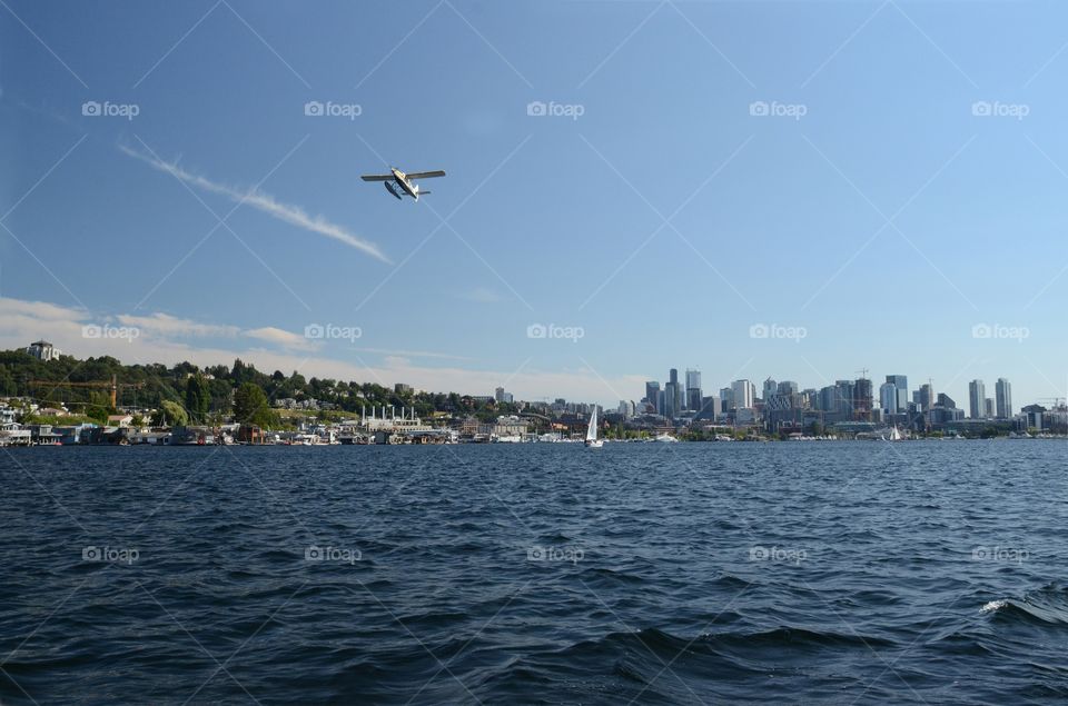 Plane fly's over Puget sound in West Seattle, Washington.