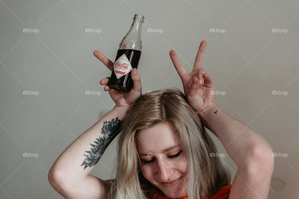 girl having fun with coca cola