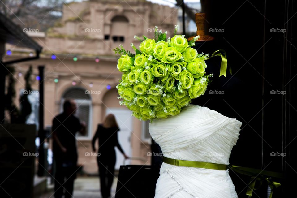 wedding dress with green roses