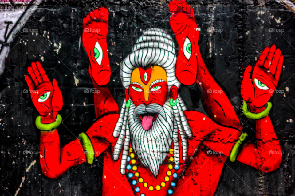 "The destroyer..." - As per the Hindu mythology, shiva is considered as the God of destroyer....This is a wall painting in the holy and yoga city of India, Rishikesh. The color red represents the anger of Lord Shiva...