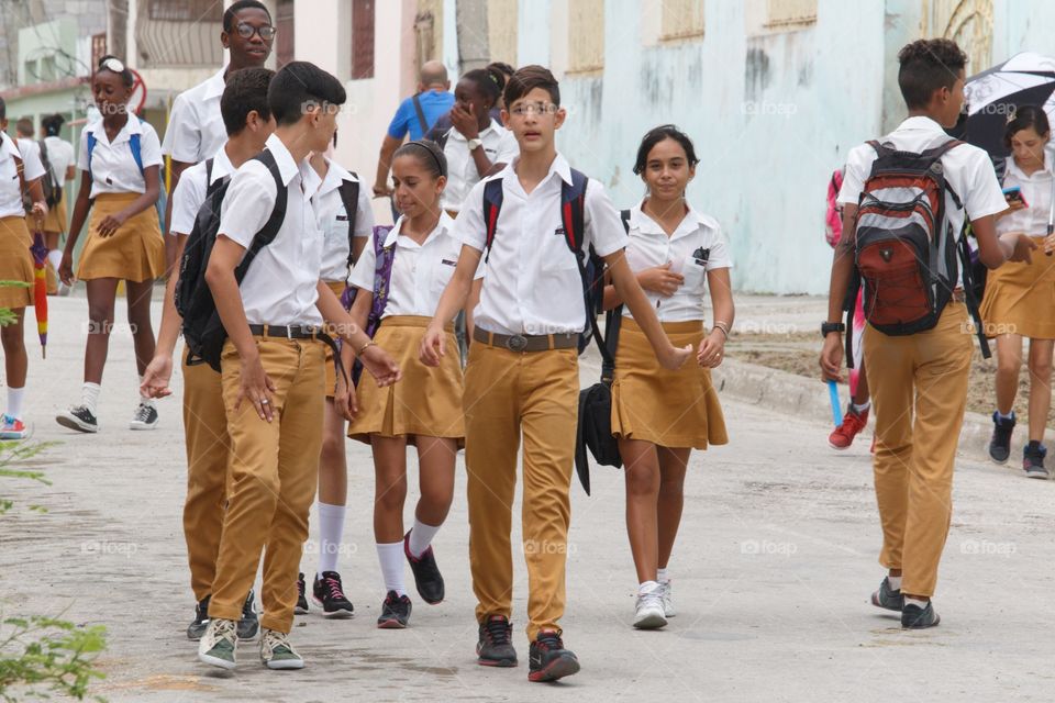 Cuban People.Secondary school students walking down a street in Guantanamo.