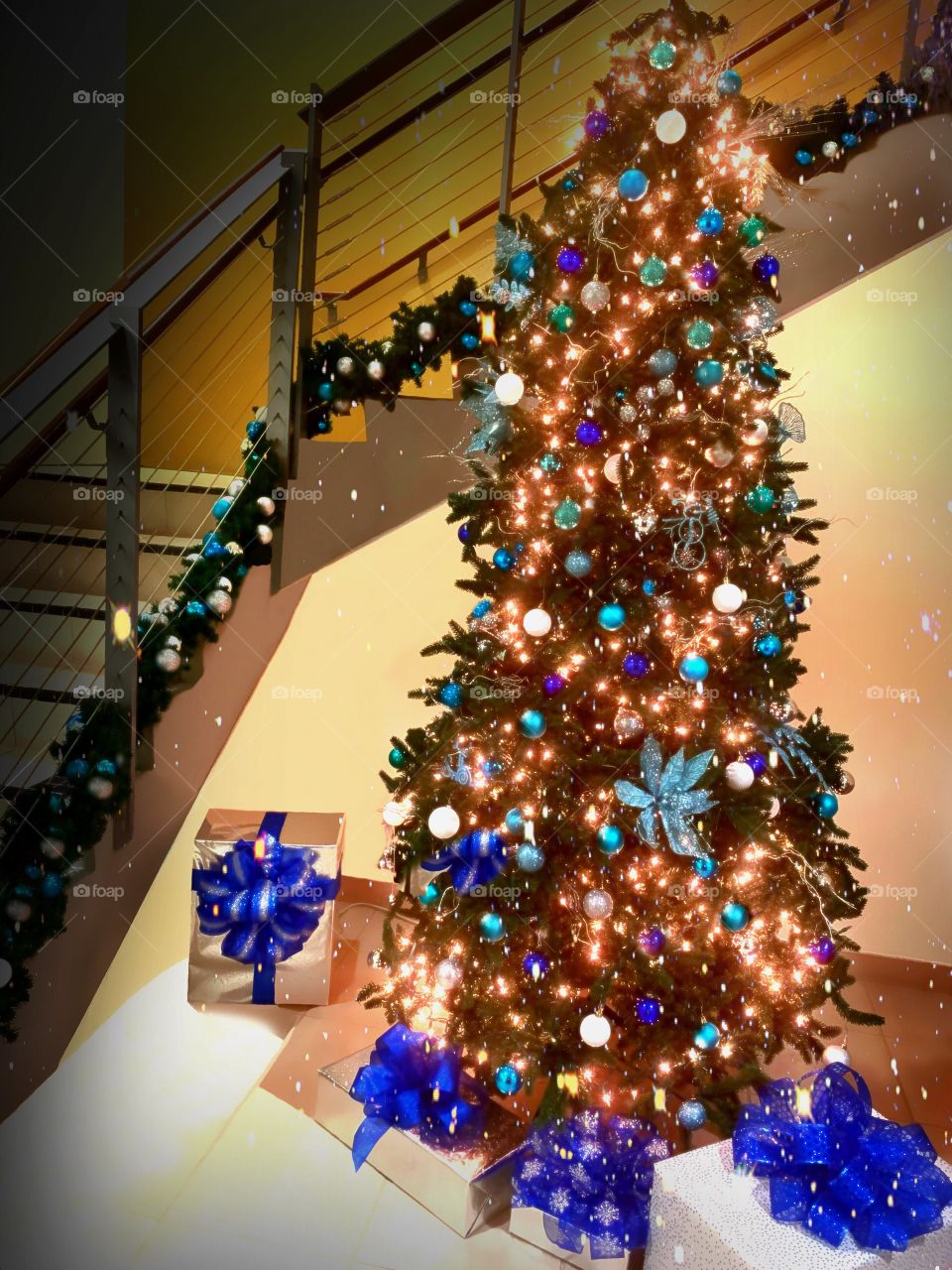 Sparkling Christmas Tree and decorated staircase.