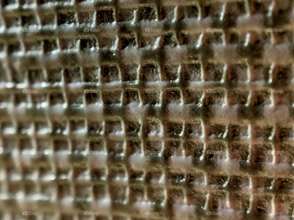 close up of a textured wall with grid design