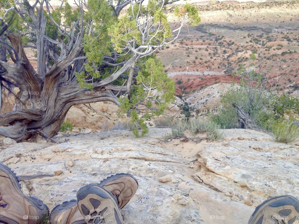 Taking a break on the hiking trail while enjoying a view of the valley