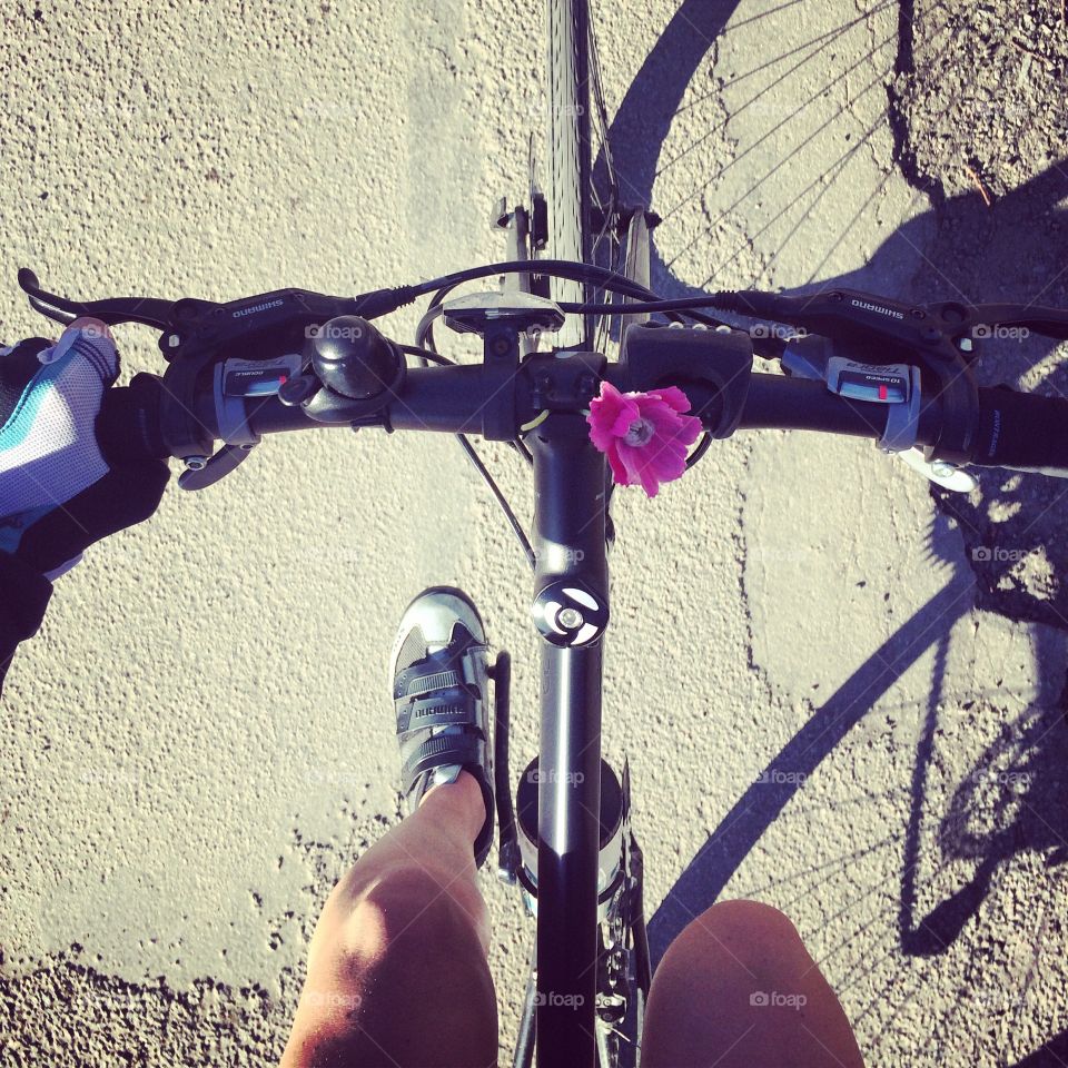 Bicycle with pink flower on handlebar