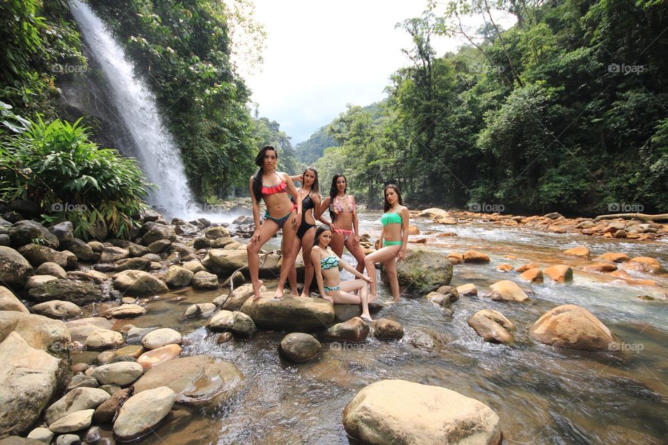 Girls group in river waterfall Costa Rica 