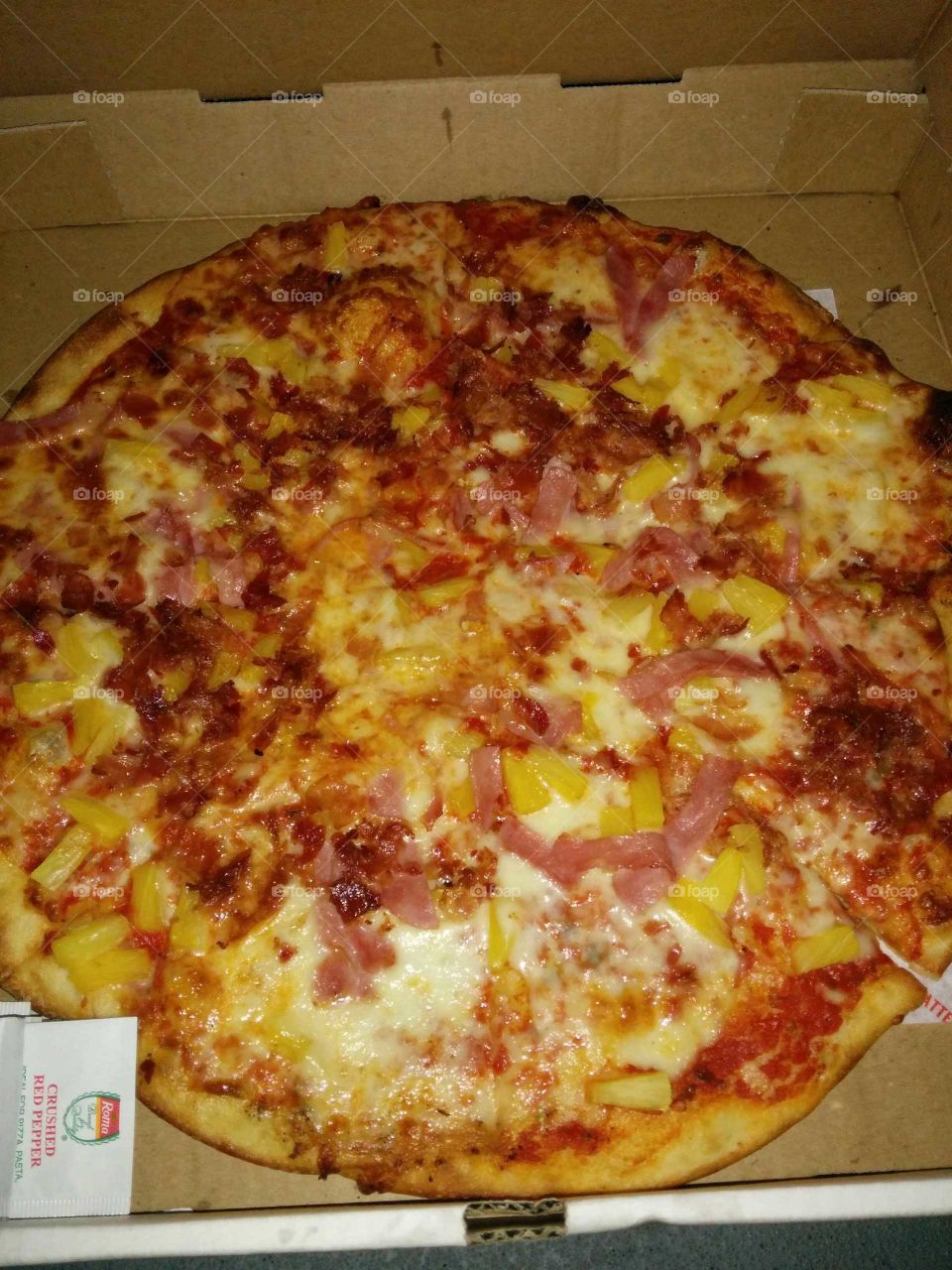 Pizza with ham and pineapple