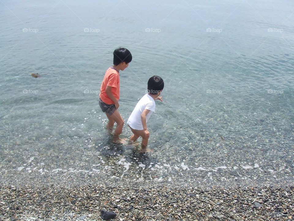 Playing in water edge. 
