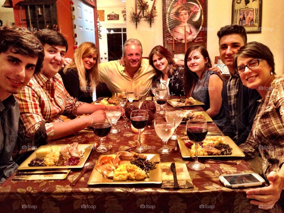 Family and friends celebrating Thanksgiving dinner