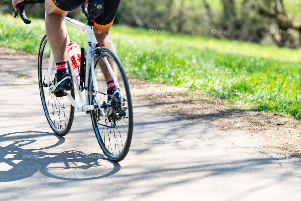 zoomed in  - cyclist in motion on his racing bike