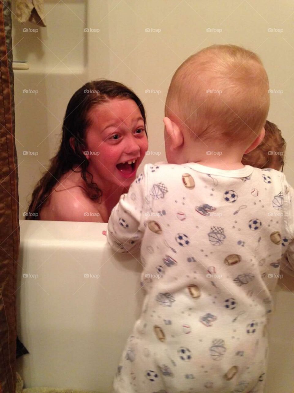 Bathtub laughing. 