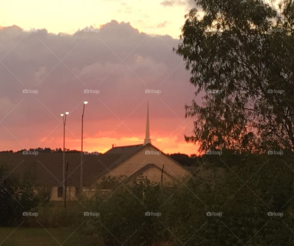 Country church at sunset. 