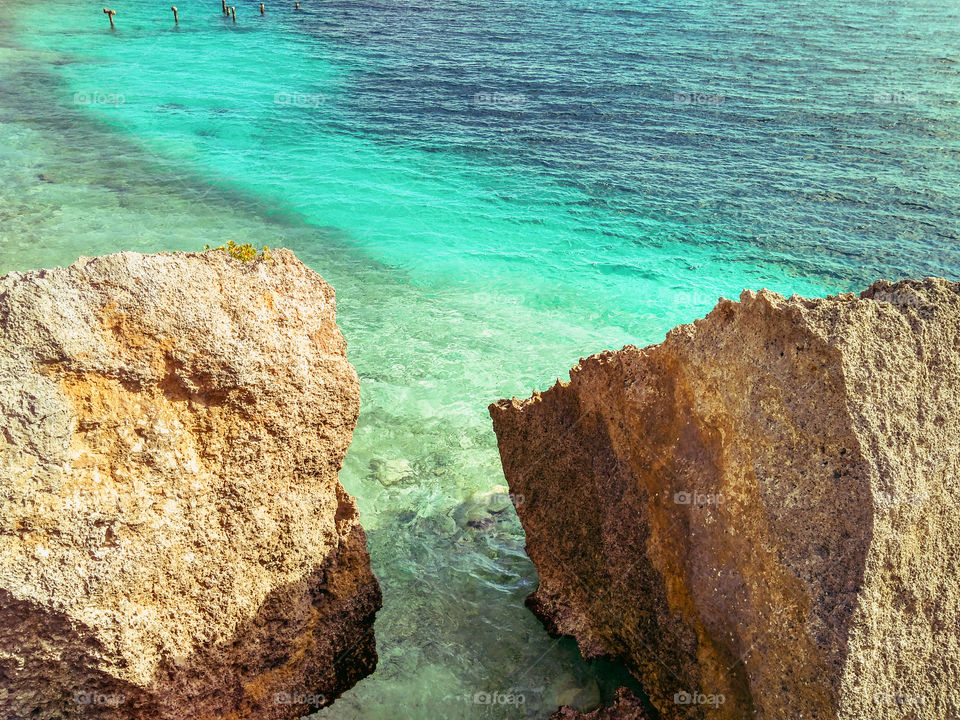 beautiful colors of the sea between 2 giant rocks