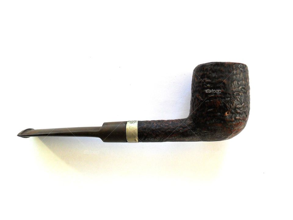 Smoking pipe on white blackground 