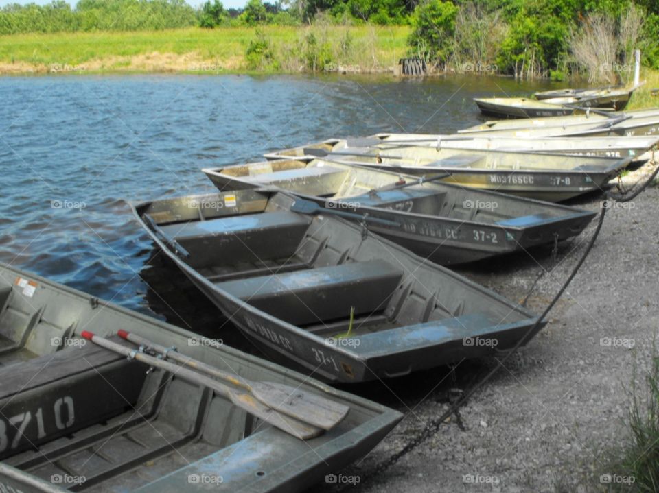 Lake boats on the shoreline for fishing 